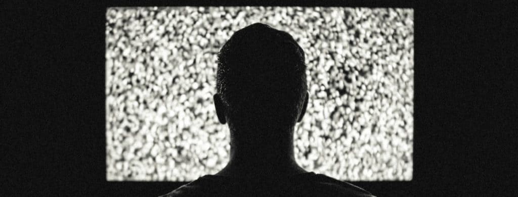Silhouette of Man in Front of Tv